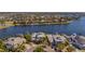 Beautiful aerial view of waterfront homes with private docks and lush landscaping at 5321 Fishersound Ln, Apollo Beach, FL 33572