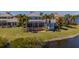 Beautiful home with backyard oasis, pool, lush lawn, and stunning waterfront view at 5321 Fishersound Ln, Apollo Beach, FL 33572