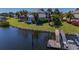 Waterfront home featuring lush backyard, swimming pool, and dock on the calm waters at 5321 Fishersound Ln, Apollo Beach, FL 33572