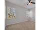 Neutral bedroom featuring carpet, white walls, two windows with shutters, and a ceiling fan at 5321 Fishersound Ln, Apollo Beach, FL 33572
