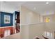 Upstairs bonus room featuring dark wood floors, a wet bar, and a stairway at 5321 Fishersound Ln, Apollo Beach, FL 33572