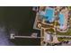 Aerial shot of the community pool featuring lap lanes, a waterslide and multiple seating areas at 5321 Fishersound Ln, Apollo Beach, FL 33572