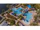 Community pool featuring lap lanes, a splash pad with seating, and waterslide at 5321 Fishersound Ln, Apollo Beach, FL 33572