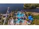 Aerial view of resort-style community pool with lap lanes, beach entry, and a waterslide at 5321 Fishersound Ln, Apollo Beach, FL 33572