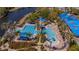 An elevated shot of the community pool with lap lanes, waterslide, and sunbathing area at 5321 Fishersound Ln, Apollo Beach, FL 33572