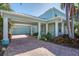 Spacious brick driveway leading to an attached two-car garage at 5321 Fishersound Ln, Apollo Beach, FL 33572