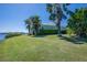 Lush greenery surrounds this waterfront home, creating a private, serene setting at 5321 Fishersound Ln, Apollo Beach, FL 33572