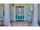 Inviting front door with decorative glass, sidelights and covered entry at 5321 Fishersound Ln, Apollo Beach, FL 33572
