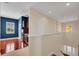View of hallway featuring a bar and hardwood floors at 5321 Fishersound Ln, Apollo Beach, FL 33572