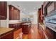 Updated kitchen offers hardwood floors, island, and top of the line appliances at 5321 Fishersound Ln, Apollo Beach, FL 33572