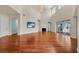 Bright living room with hardwood floors, fireplace, high ceilings, and large windows at 5321 Fishersound Ln, Apollo Beach, FL 33572