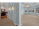 Spacious primary bedroom boasts a water view and elegant lighting, leading to an attached bathroom at 5321 Fishersound Ln, Apollo Beach, FL 33572