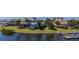 Waterfront property with a private dock, lush lawn, and serene water views, perfect for relaxation at 5321 Fishersound Ln, Apollo Beach, FL 33572