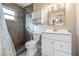 Updated bathroom featuring a tiled shower, modern vanity, and updated fixtures at 5419 Cyril Dr, Dade City, FL 33523