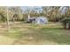 Well-maintained ranch style home with a spacious yard, and a large brick chimney at 5419 Cyril Dr, Dade City, FL 33523