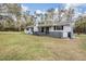 Charming single story house features a brick facade, black shutters, and a spacious yard at 5419 Cyril Dr, Dade City, FL 33523