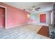 Large living room boasting a brick fireplace, tile flooring and many windows for natural light at 5419 Cyril Dr, Dade City, FL 33523
