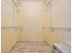 Spacious walk-in closet featuring wire shelving for easy organization and plenty of storage space at 5419 Cyril Dr, Dade City, FL 33523