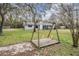 Spacious yard with a swing set, providing ample space for outdoor activities at 5419 Cyril Dr, Dade City, FL 33523