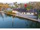 Waterfront home with large deck, mature trees, and canal access perfect for boating and enjoying waterfront living at 56 Sandpiper Rd, Tampa, FL 33609