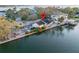 Waterfront property featuring a private boat dock and a cozy backyard at 56 Sandpiper Rd, Tampa, FL 33609