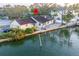 Waterfront property with dock, lush landscaping, and direct access to the canal creating a serene living experience at 56 Sandpiper Rd, Tampa, FL 33609
