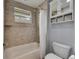 Bathroom featuring a shower-tub combination at 5611 S Russell St, Tampa, FL 33611