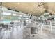 Community restaurant area with roll-up glass doors opening to pool, with vaulted wood ceiling at 5820 Creek Ridge Rd, Brooksville, FL 34601