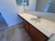 Close up of bathroom vanity featuring under sink cabinets and sleek faucet hardware at 6283 Lorraine Ln, Spring Hill, FL 34608