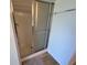 Bathroom showcasing a glass-enclosed shower and a towel rack at 6283 Lorraine Ln, Spring Hill, FL 34608