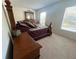 Bedroom featuring a bed with decorative pillows, wood furniture, and natural light at 6283 Lorraine Ln, Spring Hill, FL 34608