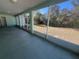 Relaxing enclosed back patio showcasing a view of the green backyard at 6283 Lorraine Ln, Spring Hill, FL 34608