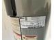 Close up of the water heater with some warning labels and specs about the water heater at 6283 Lorraine Ln, Spring Hill, FL 34608