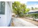 Backyard area offering a relaxing outdoor space near the house with lush foliage at 6906 N Central Ave, Tampa, FL 33604