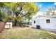 Backyard features mature trees, providing great shade, and a storage shed at 6906 N Central Ave, Tampa, FL 33604