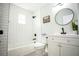 Bathroom featuring sleek black fixtures, black and white tile floors, and white subway tile in the shower at 6906 N Central Ave, Tampa, FL 33604