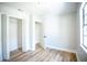 The bedroom has light hardwood floors, and a closet at 6906 N Central Ave, Tampa, FL 33604