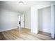 Bright bedroom features wood floors, fresh white walls, and a closet at 6906 N Central Ave, Tampa, FL 33604