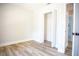 The bedroom has an open closet, hardwood floors, and an ensuite bathroom at 6906 N Central Ave, Tampa, FL 33604