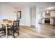 The dining room features a wooden table and a view into the open kitchen at 6906 N Central Ave, Tampa, FL 33604