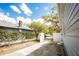 Long driveway with a fenced-in yard and plenty of parking space available at 6906 N Central Ave, Tampa, FL 33604