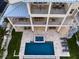 Stunning home with a private pool, spa, and multiple balconies overlooking the beautifully landscaped backyard at 6976 S Shore S Dr, St Petersburg, FL 33707