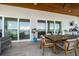 Balcony featuring a dining table and sliding glass doors with views of the water at 6976 S Shore S Dr, St Petersburg, FL 33707