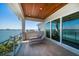 Inviting balcony offers lounge chairs and scenic water views, perfect for unwinding outdoors at 6976 S Shore S Dr, St Petersburg, FL 33707