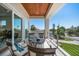 Cozy balcony with outdoor seating overlooking a residential neighborhood at 6976 S Shore S Dr, St Petersburg, FL 33707