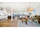Open-concept kitchen and dining area boasting gorgeous wood floors and scenic waterfront views at 6976 S Shore S Dr, St Petersburg, FL 33707