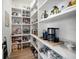 Organized walk-in pantry with generous shelving, ideal for storing food and kitchen essentials at 6976 S Shore S Dr, St Petersburg, FL 33707