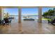 Outdoor patio with a hot tub, furniture and water views at 6976 S Shore S Dr, St Petersburg, FL 33707