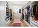 Bright, spacious walk-in closet with custom shelving, drawers, and ample storage space at 6976 S Shore S Dr, St Petersburg, FL 33707