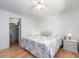 Bedroom with closet, natural light, and a floral comforter on a comfortable bed at 8622 140Th Way, Seminole, FL 33776